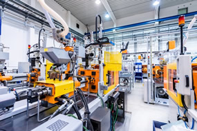 The inside of an industrial factory with automated machinery