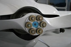 Close up detail of the front propeller of a white-colored aircraft.