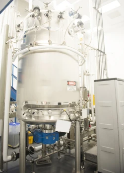 A large cylindrical metal container at a Pharmaceutical company